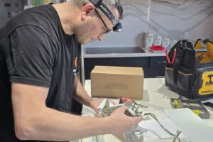 repairman repairing fridge leaking water