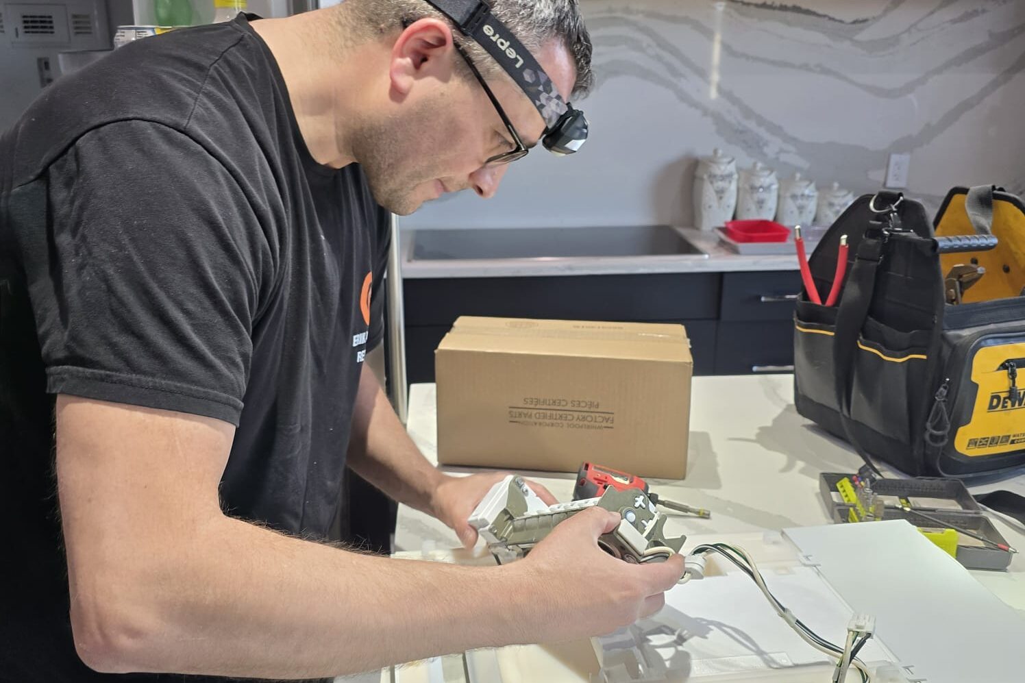 repairman repairing fridge leaking water